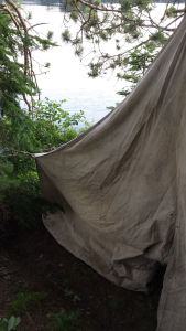 tent along the shore of a lake