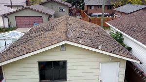 garage roof that has very worn shingles